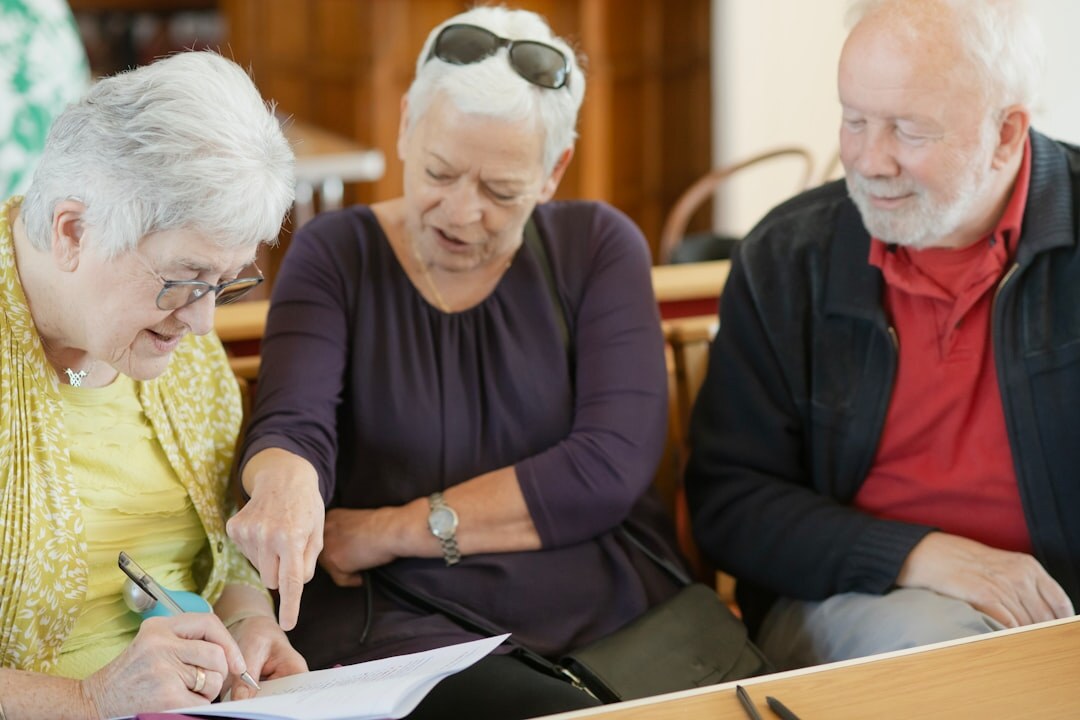 Turkish elderly couple consulting an advisor about estate documents