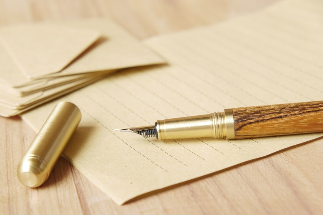 Close-up of a will document with fountain pen and glasses